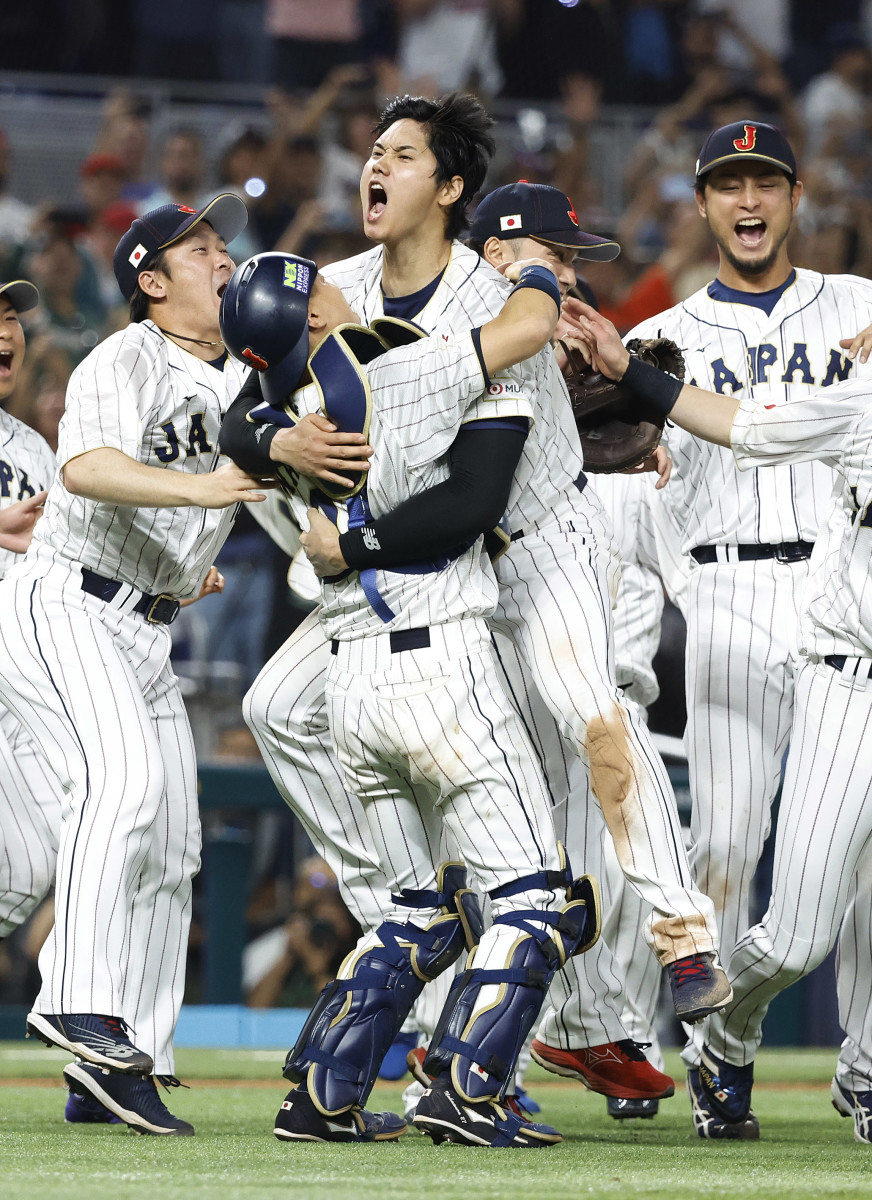 Shohei Ohtani celebrates with teammates after Japan beats U.S. for the WBC title.